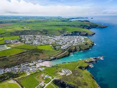 an aerial view of a town next to the ocean at Gull Lodge in Port Isaac