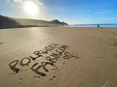 a word written in the sand on a beach at Polrunny Farm Sloe Cottage with a sea view in Boscastle