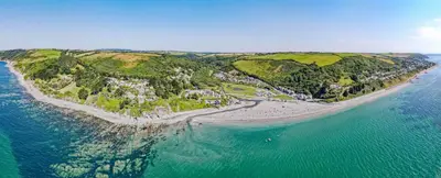 an aerial view of an island in the ocean at Breakers - Mount Brioni in Downderry