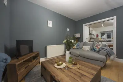 a living room with a couch and a coffee table at Windsor Lookout in St Ives