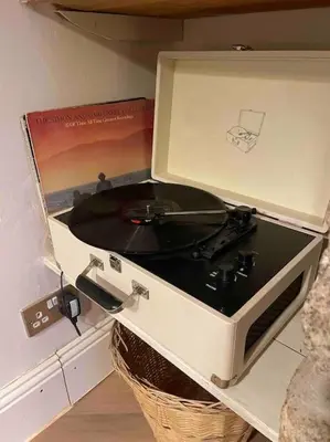 a record player with a record album in a box at No3 Gweek in Gweek