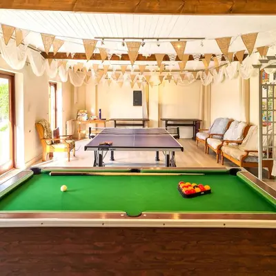 a pool table in a living room with a pool at Ta Mill Cottages & Lodges - Millers Cottage in Launceston