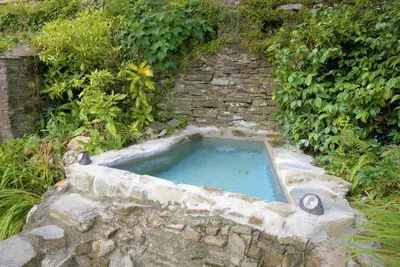 a pool of water in a stone tub at Ta Mill Cottages & Lodges - Meadowview Chalet 4 in Launceston