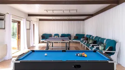 a billiard room with a pool table and chairs at Ta Mill Cottages & Lodges - Brookview Lodge 1 in Launceston
