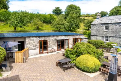 an aerial view of a stone building with a patio at Ta Mill Cottages & Lodges - Brookview Lodge 1 in Launceston