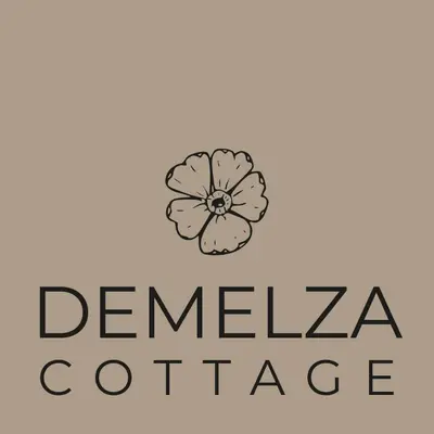 a logo for a dental office with a flower at Shepherds hut with valley views in Bodmin