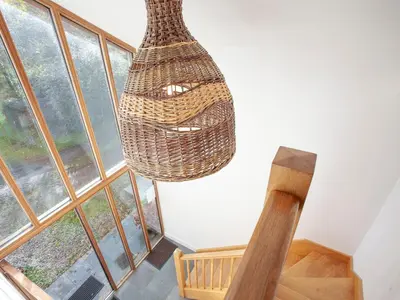 a chandelier hanging in a room with windows at Old Dairy - Uk36514 in Germoe