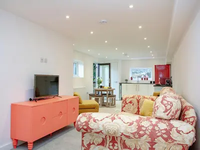 a living room with a couch and a tv at Crofty's Celder - Uk35181 in Pool