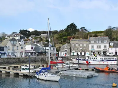 a group of boats docked at a dock in a harbor at The Lily Pad in St Merryn