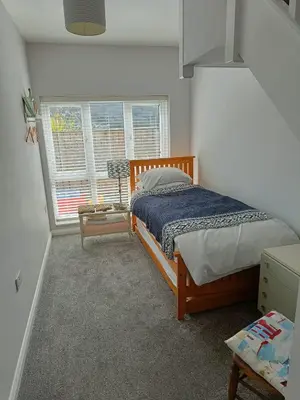 a bedroom with a bed and a window at 1 Bed Cottage - Sleeps 2 - Parking - Wifi in Truro