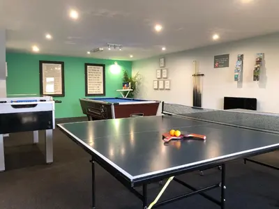 a ping pong room with a ping pong table at Coverack in Budock Water