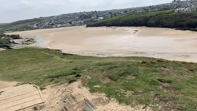 an aerial view of a sandy beach with a beach at Newquay Bay Resort 63 in Porth