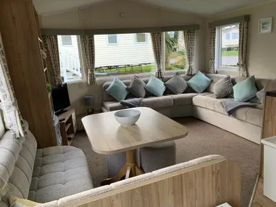a living room with a couch and a table at Newquay Bay Resort 63 in Porth