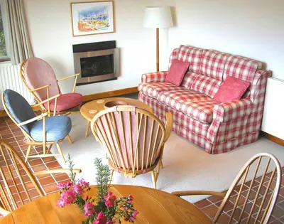 a living room with a couch and chairs at Rosevallen in Polzeath