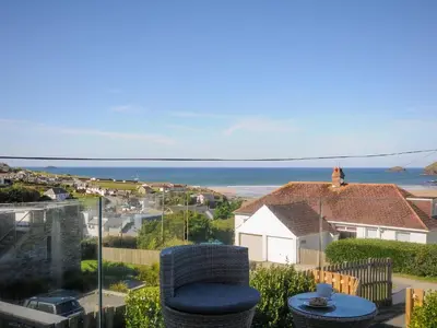 a view of the ocean from the balcony of a house at Drishti in Polzeath