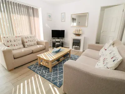 a living room with two couches and a coffee table at Ballasalla in Liskeard