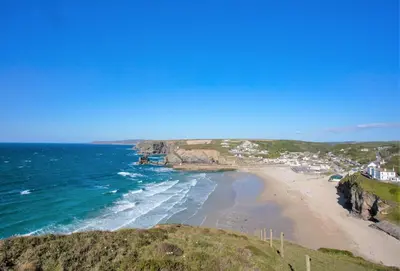 a view of a beach with the ocean at Rosebud in Portreath