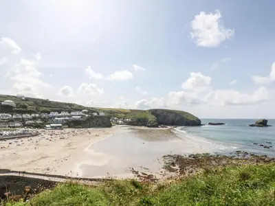 a view of a beach with people on it at Sunflower in Redruth