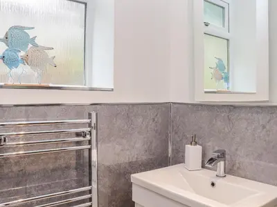 a bathroom with a sink and a mirror at The Hideaway in Chacewater