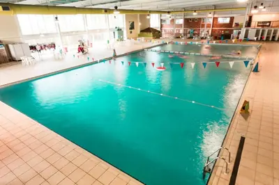 an overhead view of a swimming pool at Newquay Bay Resort 181 in Porth