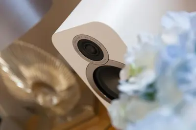 a close up of a speaker with flowers next to it at Ocean Blue in Carbis Bay