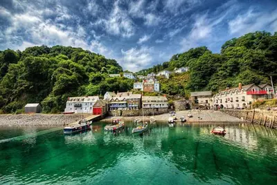 a group of boats in a body of water at Kallowen Cottage at Crackington Haven, near Bude and Boscastle, Cornwall in Bude