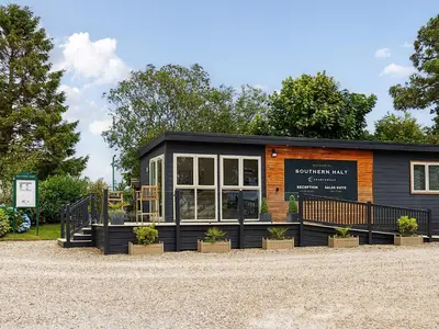a small building with plants in front of it at 6 Southern Place in Liskeard