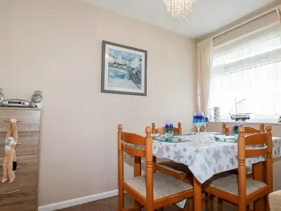a dining room with a table and chairs at Smugglers in Liskeard