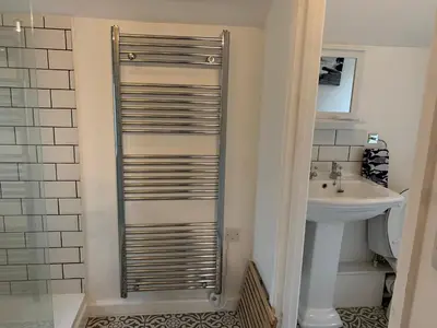 a bathroom with a toilet and a sink at 1 bed-Pet Friendly-Parking-Patio-close to coasts in North Hill