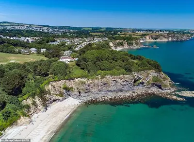 an aerial view of a beach and the ocean at Stunning Apartment, balconies, private beach, coast path in Charlestown