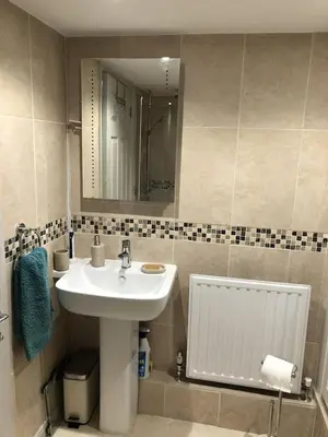 a bathroom with a sink and a mirror at The Cottage, Cox Hill House, Cox Hill, Chacewater, TR4 8LY in Truro