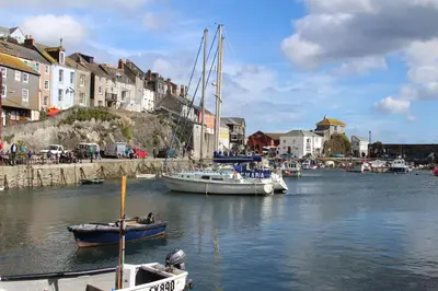 a group of boats docked in a body of water at Trewhiddle 40 - A Luxury Cottage by Together Travel in St Austell