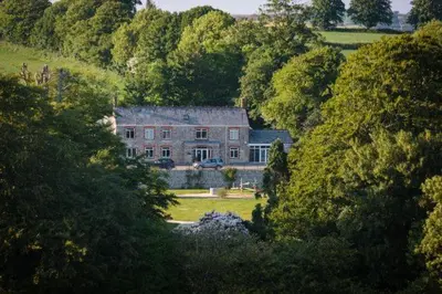 a large house in the middle of a forest at Trewhiddle Retreat V18 by Together Travel - Luxury 4-Bedroom Villa in St Austell