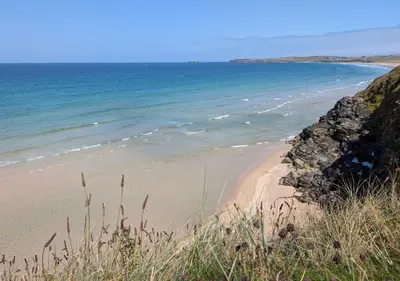 a sandy beach with the ocean in the background at D52 Boston, Riviere Towans in Hayle