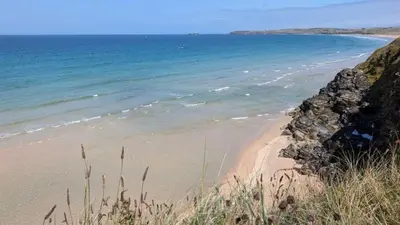 a beach with the ocean in the background at E30 Lant View, Riviere Towans in Hayle