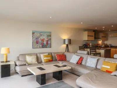 a living room with a couch and a table at Ocean View in Carbis Bay