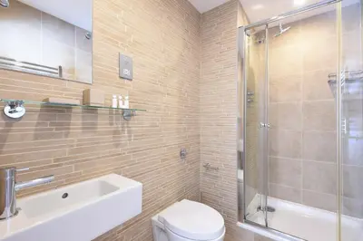 a bathroom with a toilet and a sink and a shower at Ocean View in Carbis Bay