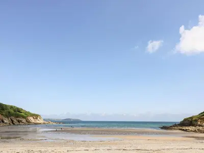 a view of a beach with the ocean in the background at Mulberry Cottage in Falmouth
