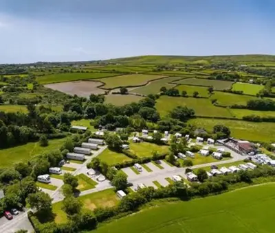 an aerial view of a large parking lot with cars at Polladras Holiday Park in Helston