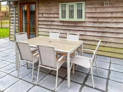 a table and chairs sitting on a patio at Chy An Dour in Davidstow