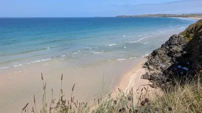 a sandy beach with the ocean in the background at F26 Porthia, Riviere Towans in Hayle