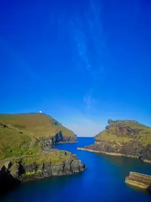 a large body of water between two islands at The little post house. A perfect village retreat, with stunning views. in Boscastle