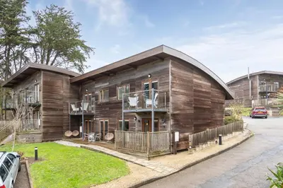a wooden house with a car parked in front of it at House 5 Ironcroft - Modern Pet-friendly, Walk to beach & village in Porthtowan